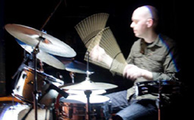 Randy Rollofson flashing drumsticks